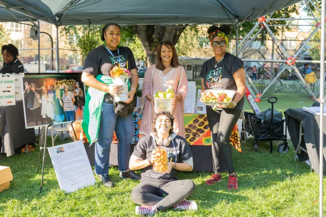 Commissioner Susheela Jayapal poses at Reclaiming Black Joy booth.