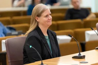 Office of Government Relations Director Stacy Cowan sits at the dais in the Multnomah Building Boardroom.